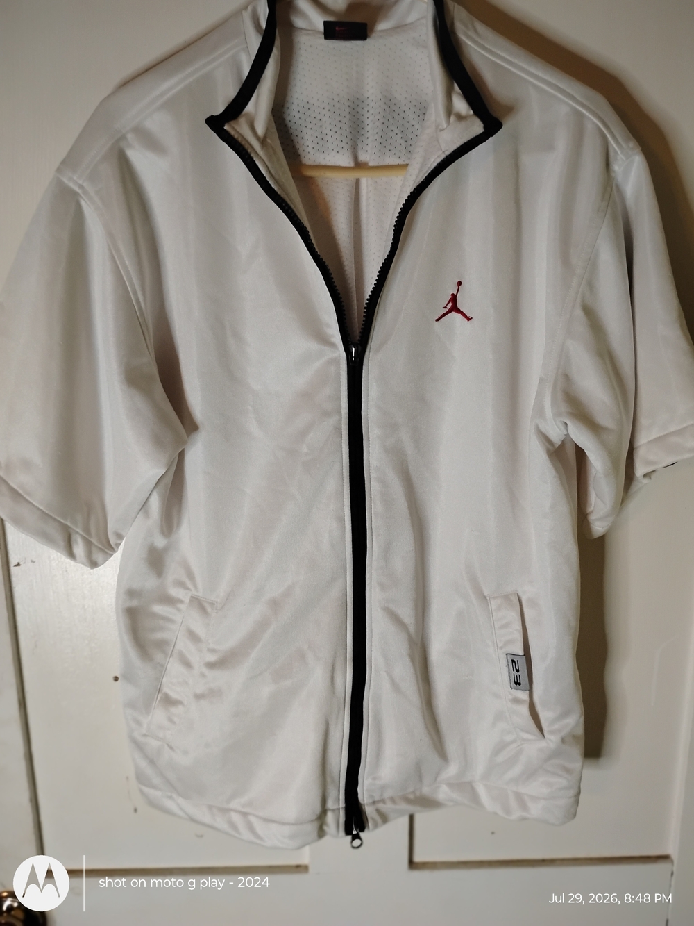 Jordan White Short-Sleeve Performance Zip Jacket with Black Trim and Red Jumpman